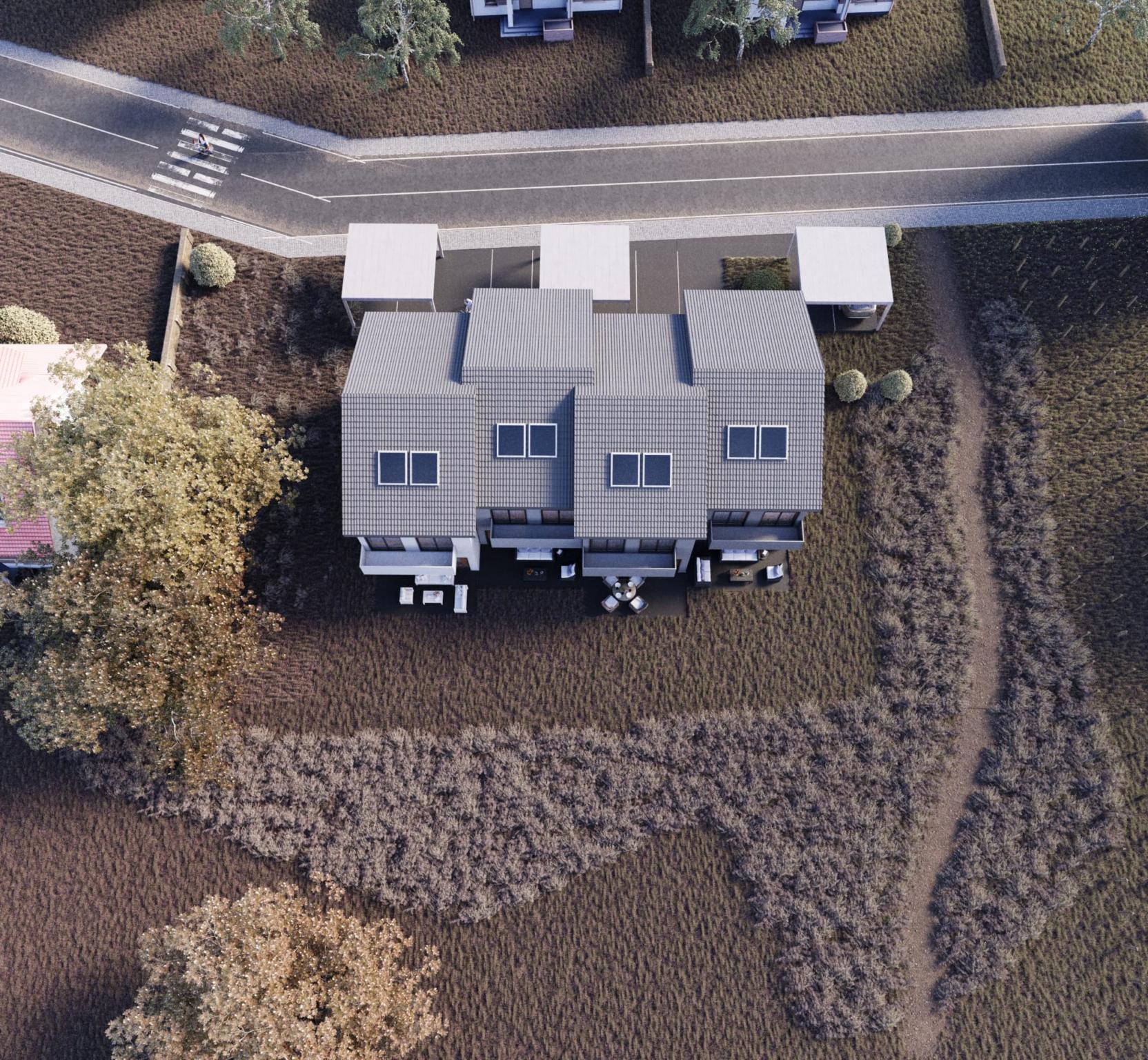 Luftaufnahme eines modernen Doppelhauses mit Garten und Stellplätzen