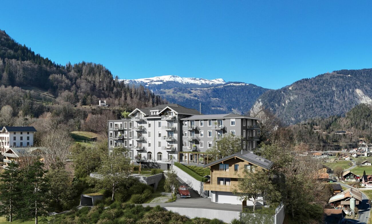 Wohnanlage in alpiner Berglandschaft