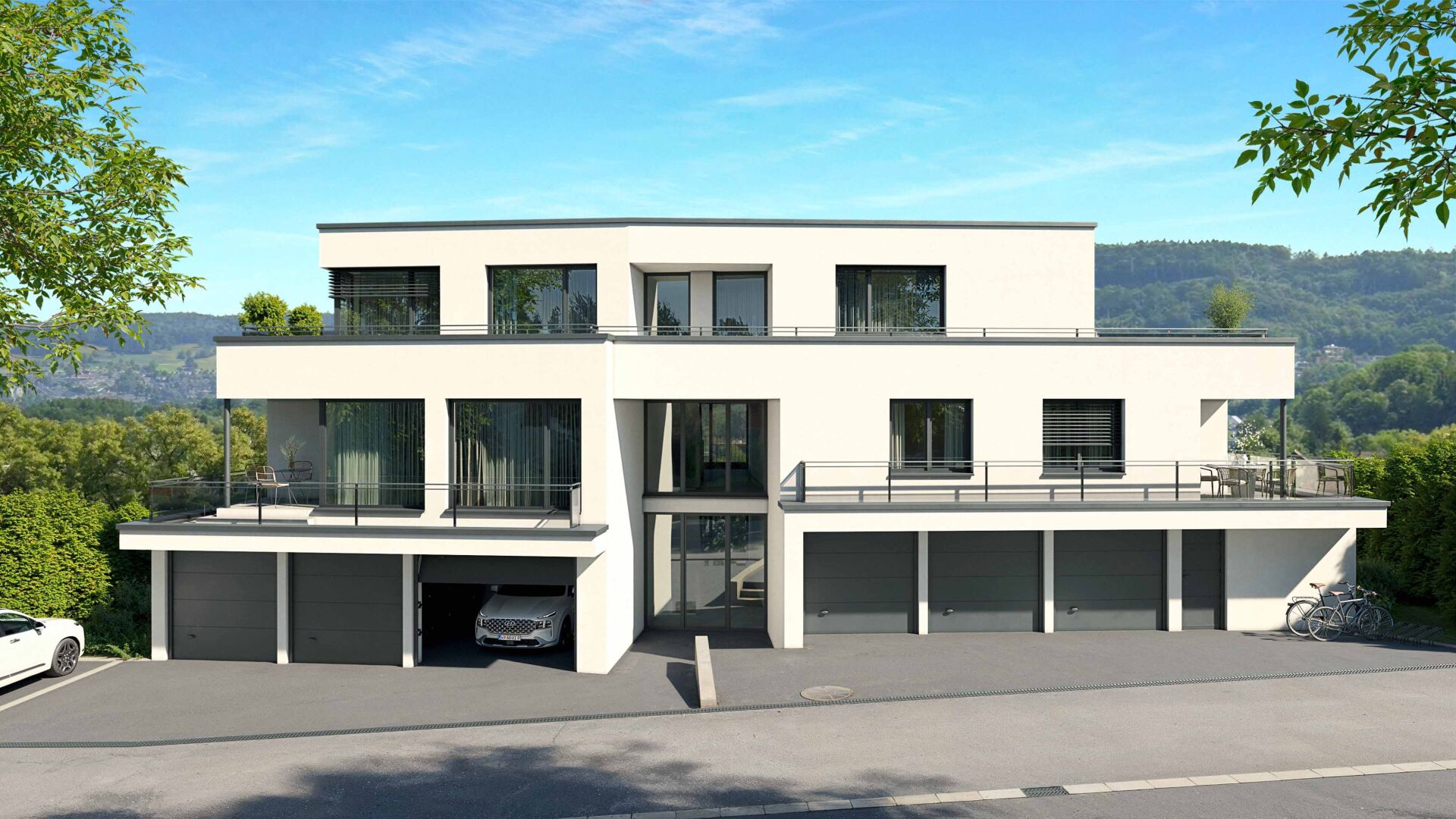 Modernes Mehrfamilienhaus mit Terrassen und Garagen