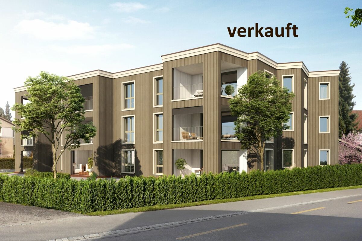 Modernes Mehrfamilienhaus mit Verkaufshinweis