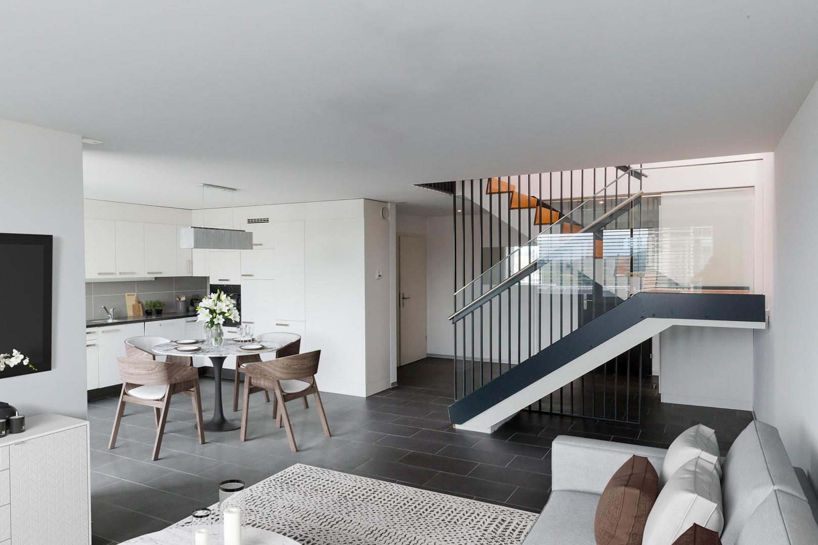 Modernes offenes Wohn-Esszimmer mit Küche und Treppe
