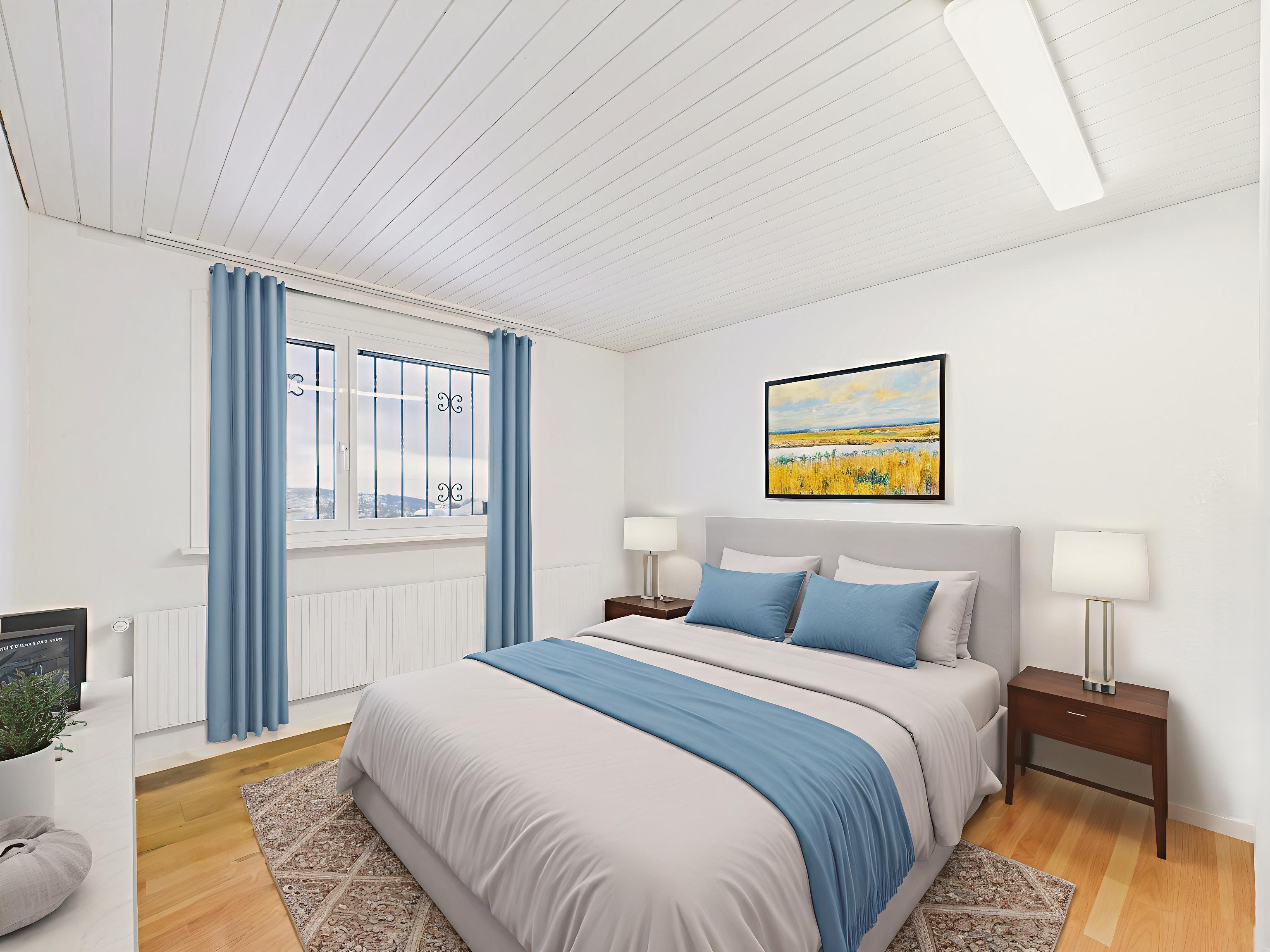 Helles Schlafzimmer mit Einzelbett und blau-weißer Einrichtung
