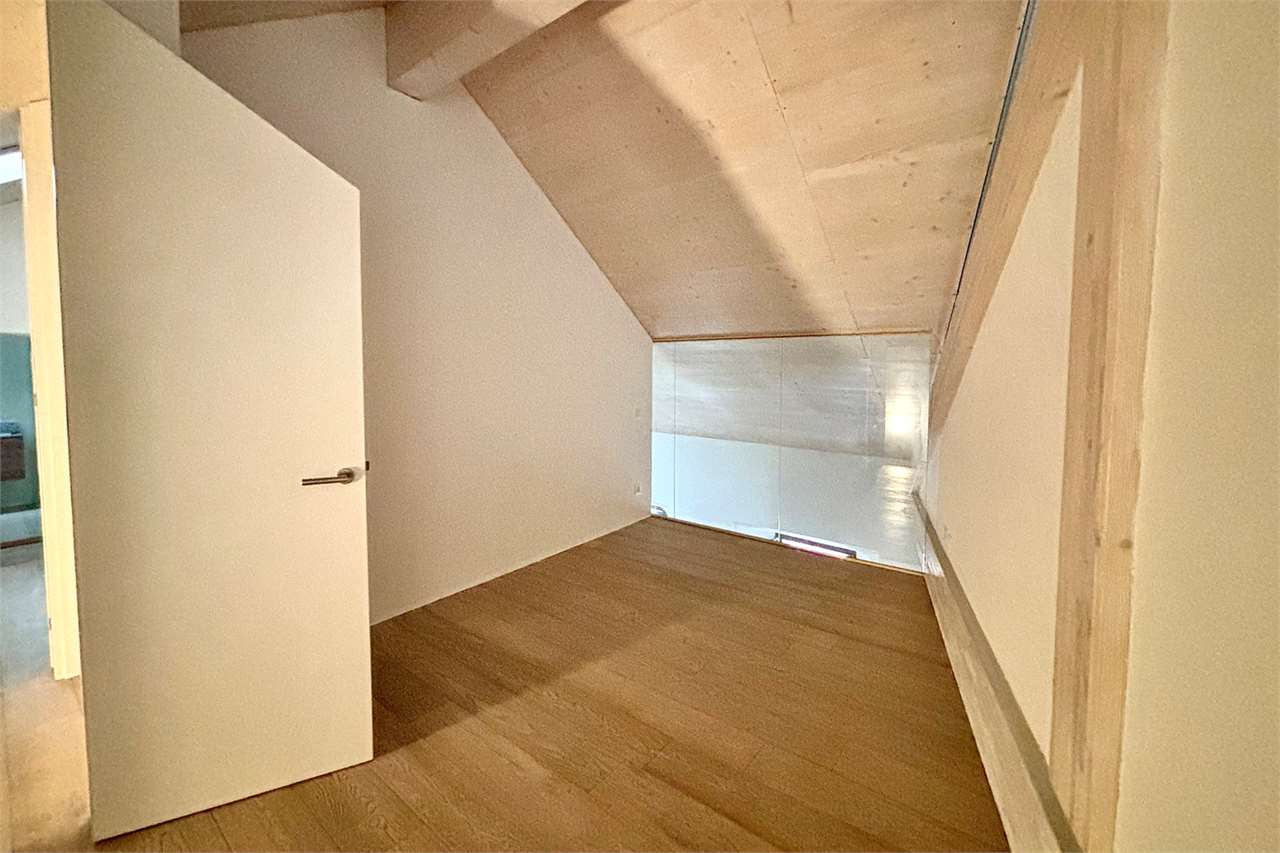 Dachgeschossraum mit Holzboden