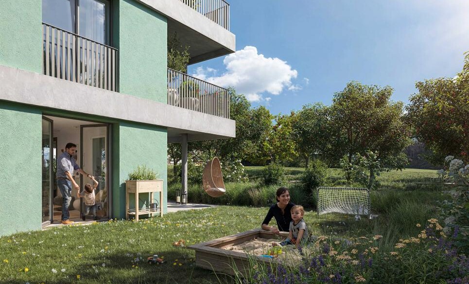 Außenansicht eines modernen Mehrfamilienhauses mit Garten