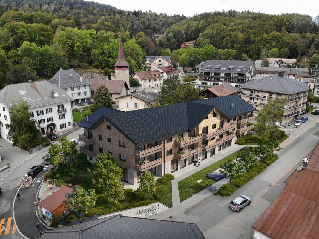 Luftaufnahme eines modernen Gebäudekomplexes in einer kleinen Ortschaft