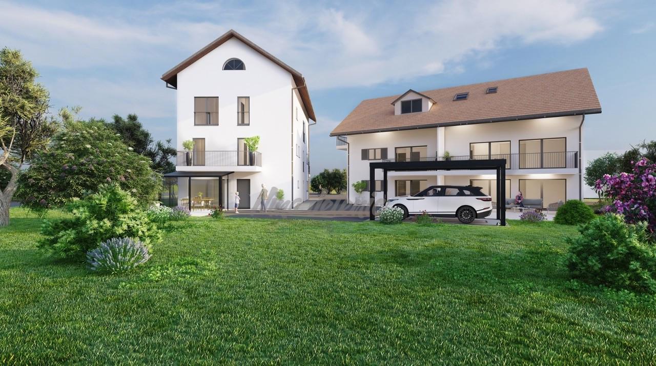 Moderne Wohnhäuser mit Garten und Carport