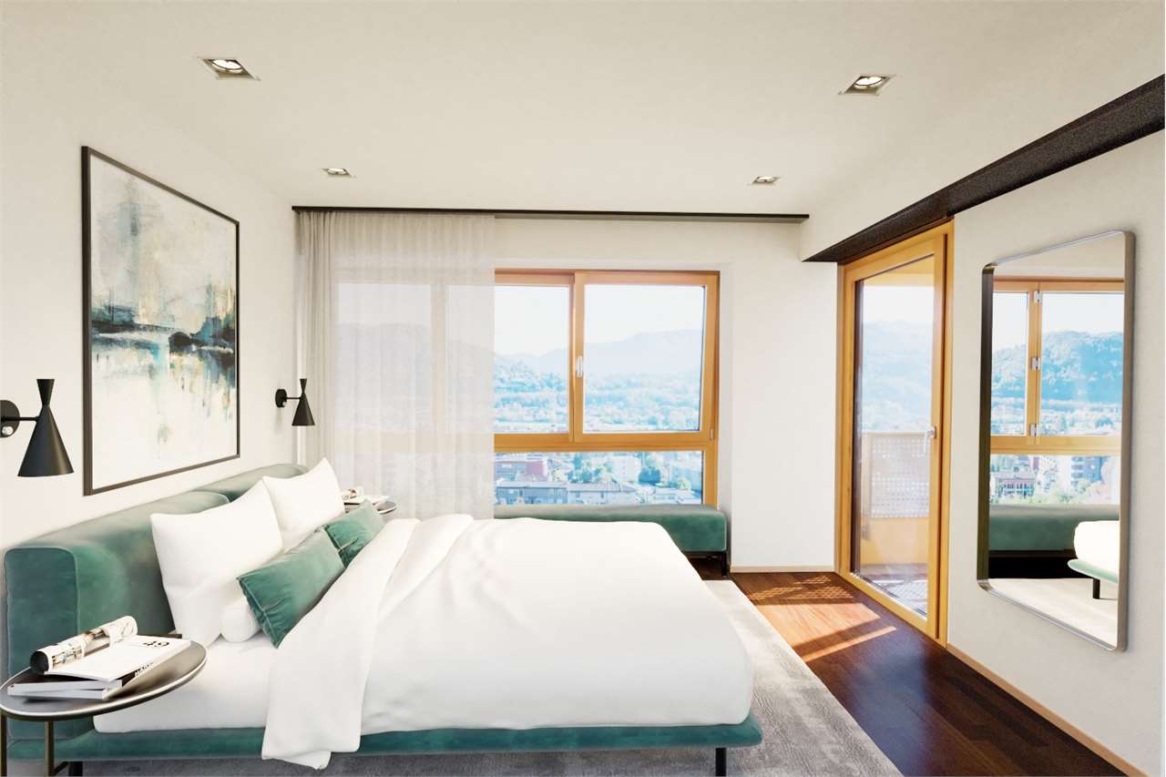 Modernes Schlafzimmer mit Balkonblick