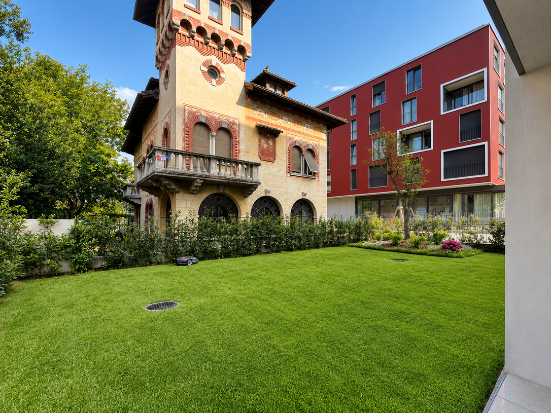 Historischer Turm mit moderner Wohnanlage und Garten