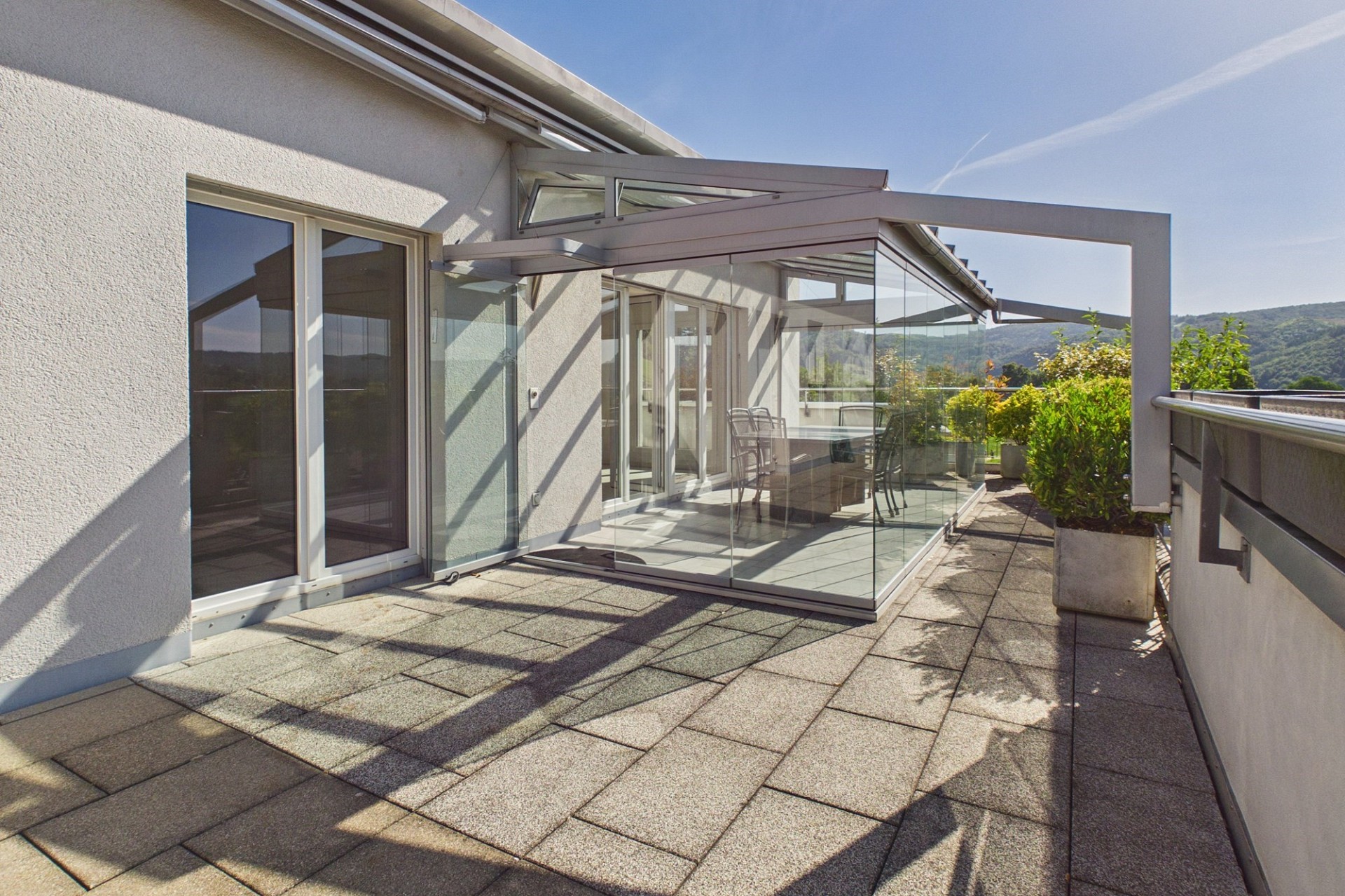 Dachterrasse mit Glasüberdachung