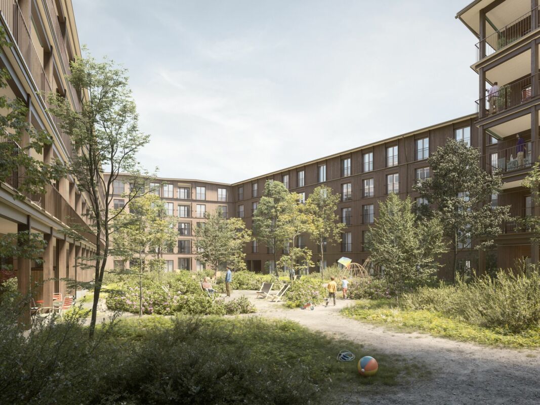 Innenhof einer modernen Wohnanlage mit Grünfläche
