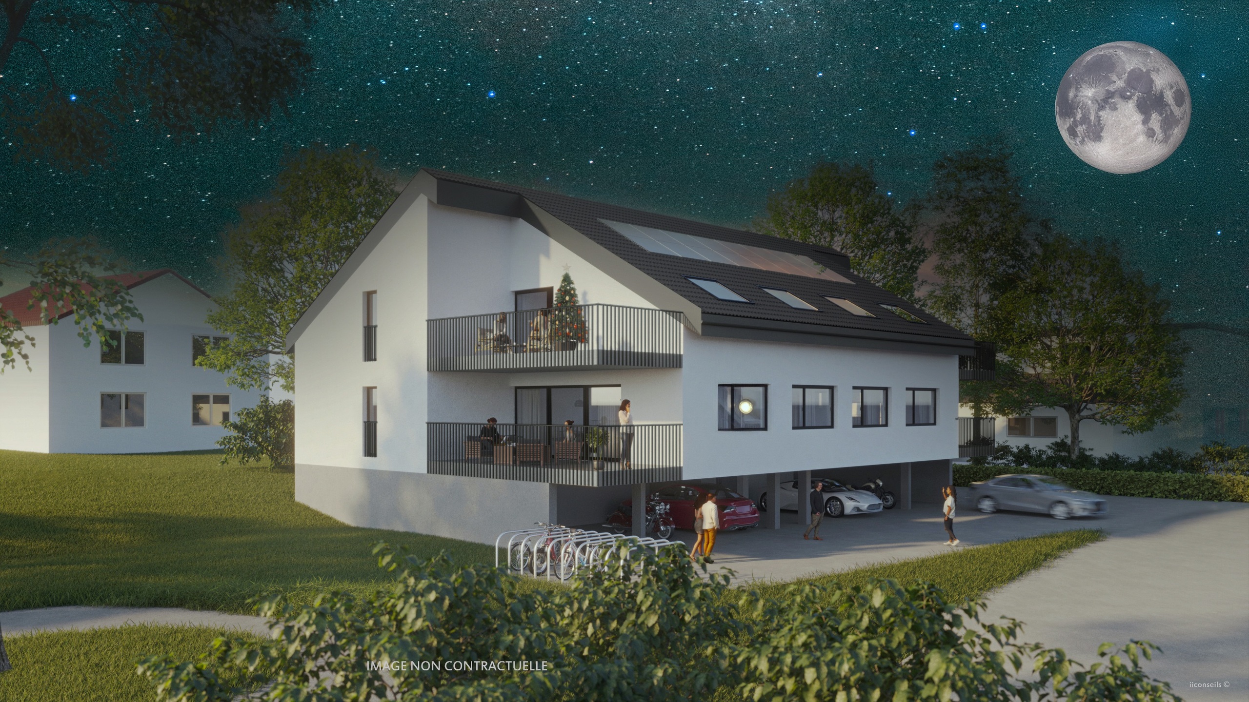 Modernes Wohnhaus mit Stellplatz und Balkon bei Nacht